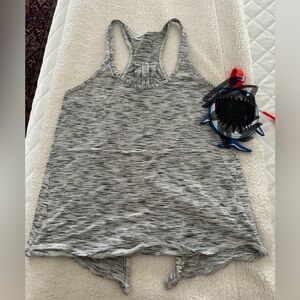 Lululemon tank. White and black. Tie in back. Like new. Size 6.
